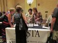 Agents stop by the Arizona ASTA booth to join our chapter